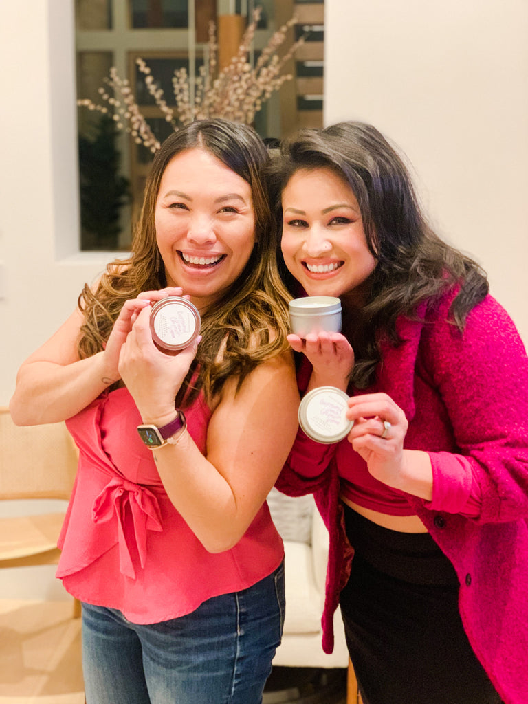 women love our candles - two women smelling our hand poured soy candles