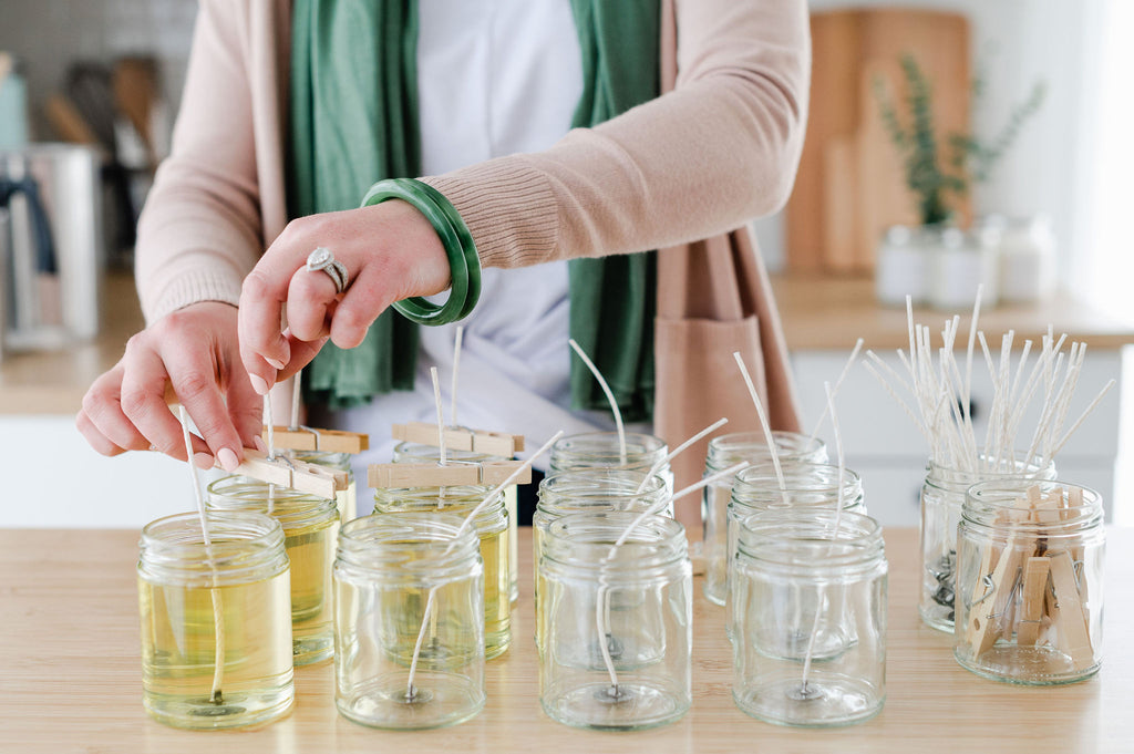woman making soy candles in a candle studio 