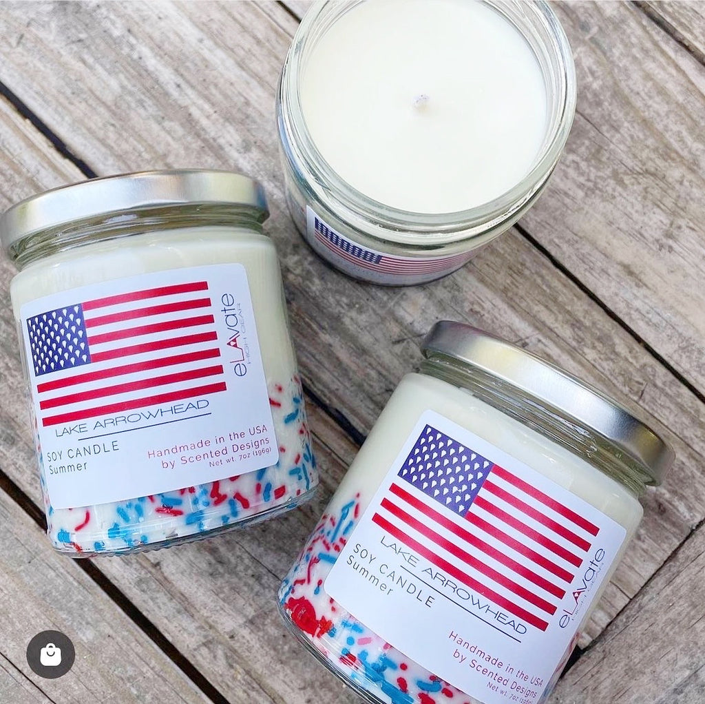 custom label candles for fourth of july with an american flag on the label and red white and blue sprinkles in the candle 